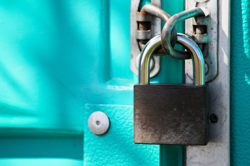 A heavy padlock securing a door